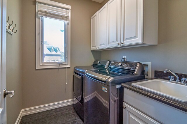 194 W Reed Lk, Commerce Twp, MI 48390 - laundry area featuring independent washer and dryer, cabinet space, baseboards, and plenty of natural light
