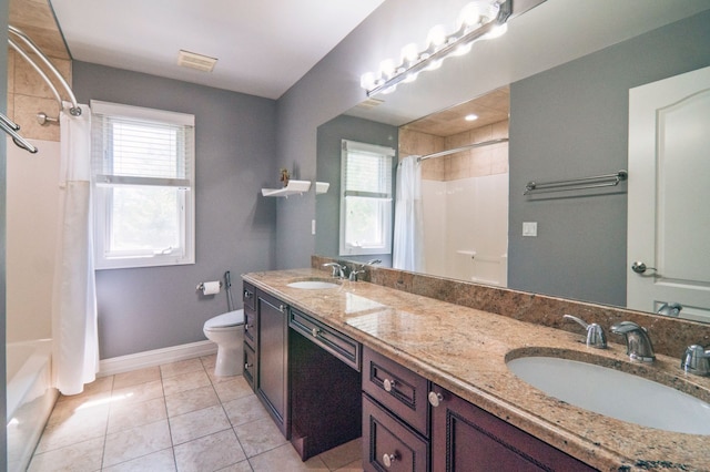 194 W Reed Lk, Commerce Twp, MI 48390 - bathroom featuring toilet, baseboards, double vanity, tile patterned floors, and shower / bath combo