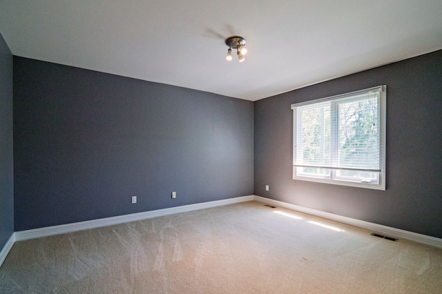 194 W Reed Lk, Commerce Twp, MI 48390 - empty room featuring light carpet and baseboards