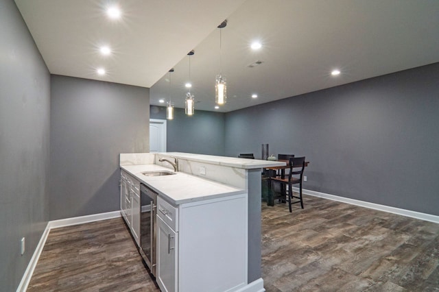 194 W Reed Lk, Commerce Twp, MI 48390 - kitchen with a sink, a peninsula, dark wood-type flooring, wine cooler, and recessed lighting