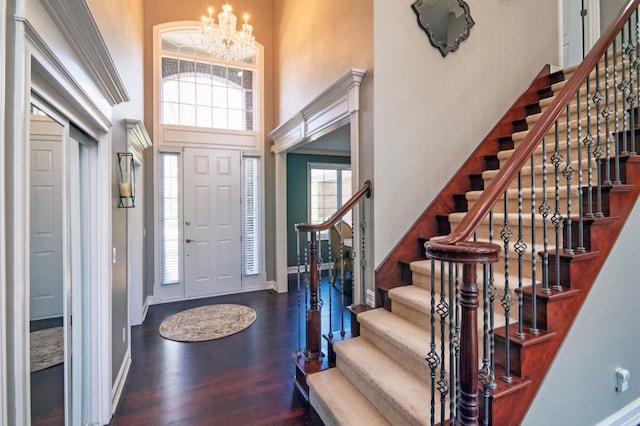194 W Reed Lk, Commerce Twp, MI 48390 - entrance foyer with a towering ceiling, wood finished floors, a chandelier, baseboards, and stairway