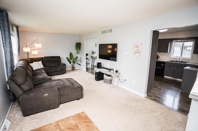 11748 Cloverview Dr, Ravenna, MI 49451 - living area featuring carpet floors and baseboards