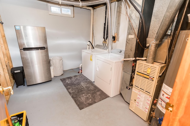 11748 Cloverview Dr, Ravenna, MI 49451 - laundry area featuring independent washer and dryer