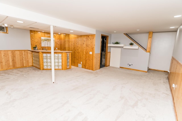 11748 Cloverview Dr, Ravenna, MI 49451 - finished below grade area with wooden walls, carpet floors, bar, and recessed lighting