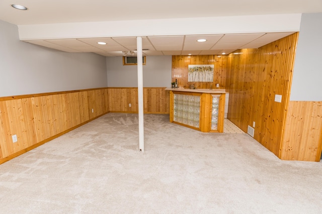11748 Cloverview Dr, Ravenna, MI 49451 - finished below grade area featuring wood walls, carpet flooring, a wainscoted wall, and recessed lighting
