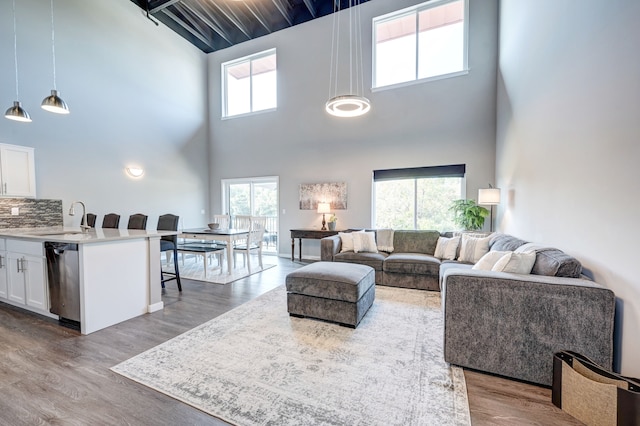 293 N 2nd St, Brighton, MI 48116 - living area with a high ceiling and wood finished floors