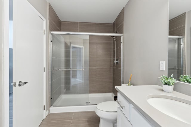 293 N 2nd St, Brighton, MI 48116 - full bathroom featuring a stall shower, vanity, toilet, and tile patterned floors
