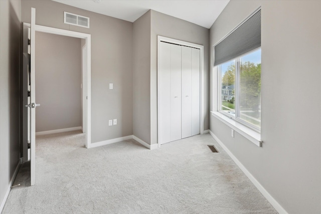 293 N 2nd St, Brighton, MI 48116 - unfurnished bedroom with carpet, a closet, and baseboards