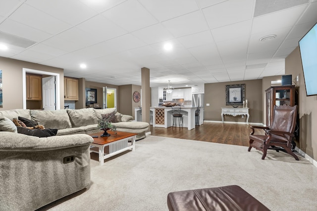08763 Silver Lake Rd, Grand Junction, MI 49056 - living room featuring dark colored carpet, baseboards, and dark wood-type flooring