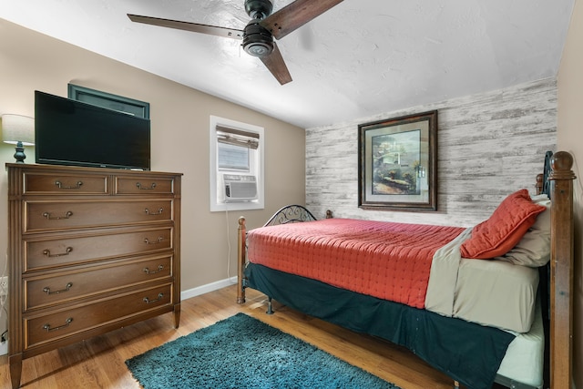 08763 Silver Lake Rd, Grand Junction, MI 49056 - bedroom with light wood finished floors, baseboards, ceiling fan, and cooling unit