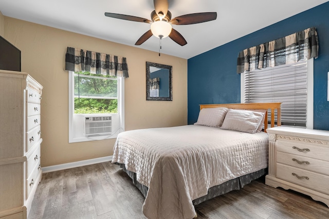 08763 Silver Lake Rd, Grand Junction, MI 49056 - bedroom with wood finished floors, cooling unit, a ceiling fan, and baseboards