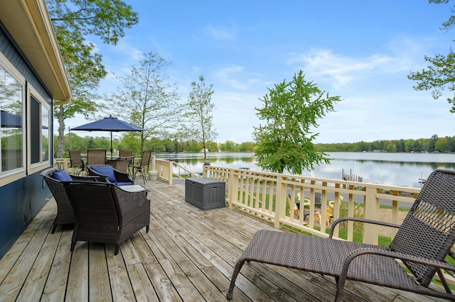 08763 Silver Lake Rd, Grand Junction, MI 49056 - deck featuring a water view and outdoor dining space