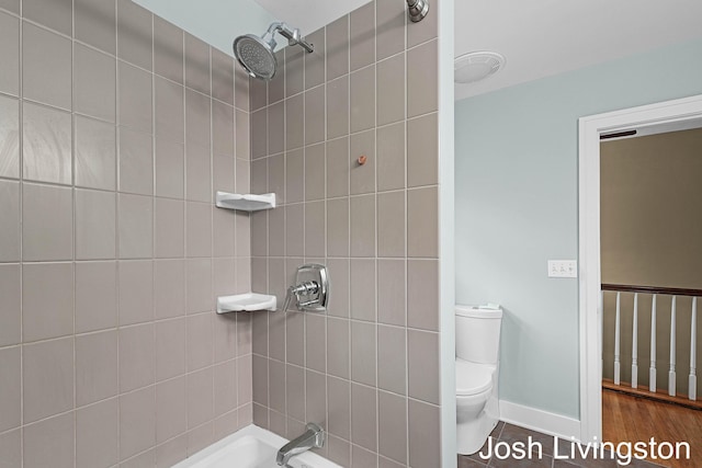 957 Breton Rd SE, Grand Rapids, MI 49506 - full bathroom featuring toilet and bathing tub / shower combination