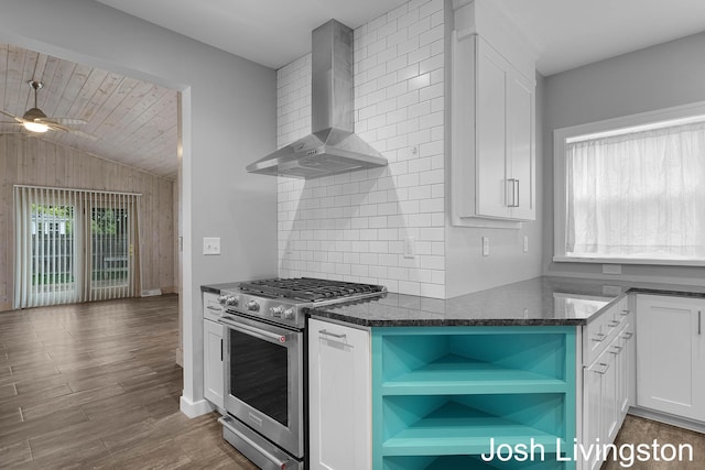 957 Breton Rd SE, Grand Rapids, MI 49506 - kitchen featuring high end stainless steel range, wall chimney range hood, open shelves, white cabinetry, and vaulted ceiling