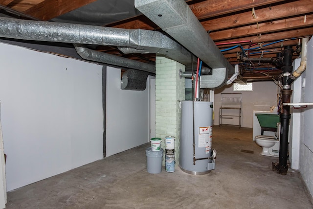 unfinished basement featuring water heater