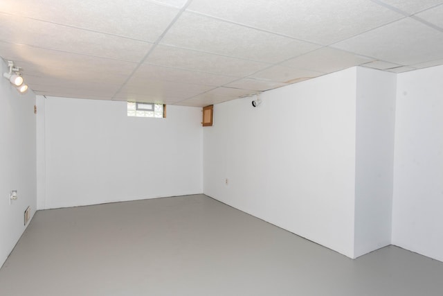 below grade area with a paneled ceiling