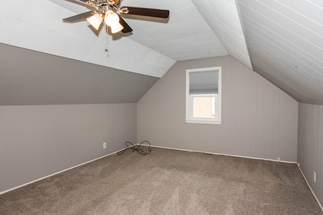 additional living space with carpet floors, vaulted ceiling, and ceiling fan