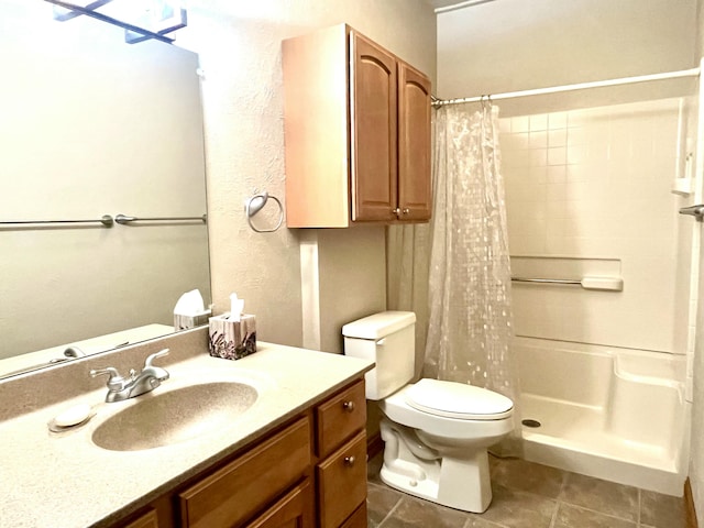 full bathroom with a shower with curtain, toilet, vanity, and tile patterned floors