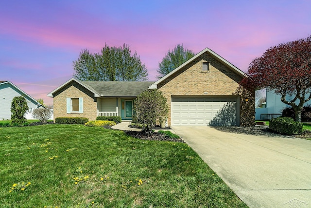 3124 Setting Sun Blvd, Saginaw, MI 48603 - ranch-style house with brick siding, a garage, driveway, and a front yard