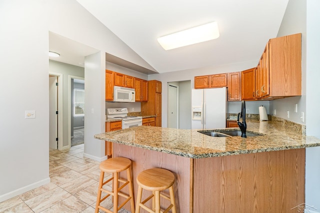 3124 Setting Sun Blvd, Saginaw, MI 48603 - kitchen with white appliances, a sink, lofted ceiling, a peninsula, and light stone counters