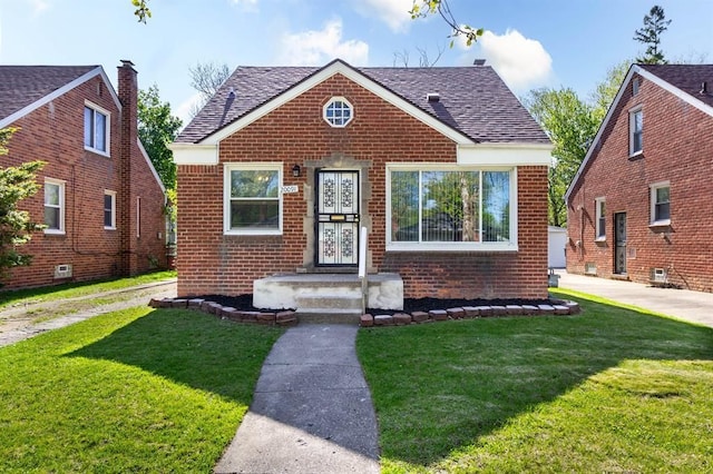 20091 Bentler St, Detroit, MI 48219 - bungalow with brick siding, a front yard, and a shingled roof