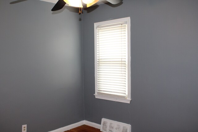 20091 Bentler St, Detroit, MI 48219 - spare room featuring a ceiling fan, healthy amount of natural light, dark wood-style flooring, and baseboards