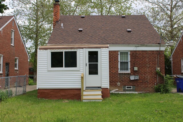 20091 Bentler St, Detroit, MI 48219 - rear view of house with entry steps, a chimney, and roof with shingles