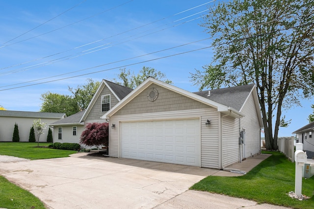 view of front facade with a garage and concrete driveway