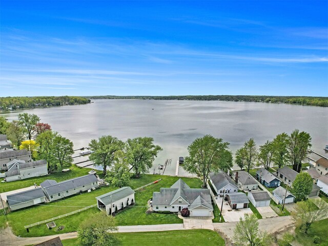 aerial view of residential area featuring a large body of water
