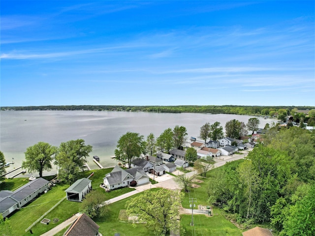 aerial view of residential area with a large body of water