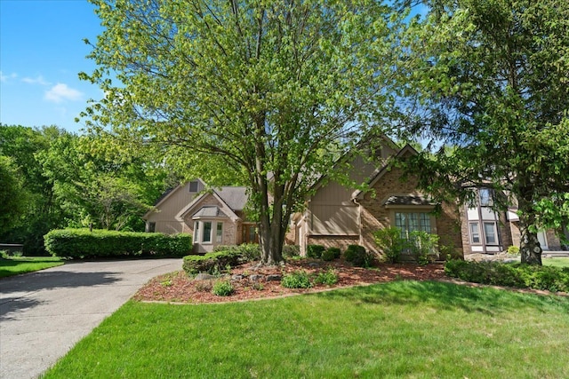 46890 Cider Mill Dr, Novi, MI 48374 - view of front of home featuring brick siding and a front lawn