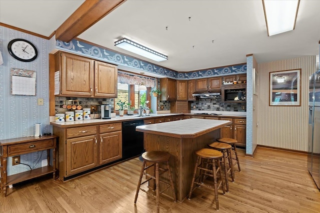 46890 Cider Mill Dr, Novi, MI 48374 - kitchen featuring wallpapered walls, dishwasher, under cabinet range hood, gas stovetop, and light wood-type flooring