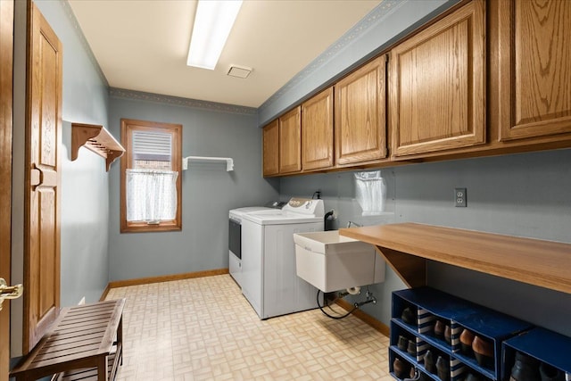 46890 Cider Mill Dr, Novi, MI 48374 - washroom featuring cabinet space, independent washer and dryer, baseboards, brick patterned flooring, and ornamental molding