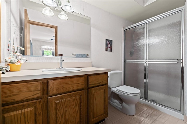46890 Cider Mill Dr, Novi, MI 48374 - bathroom featuring a stall shower, toilet, vanity, and tile patterned floors