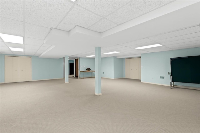 46890 Cider Mill Dr, Novi, MI 48374 - finished below grade area with a paneled ceiling, carpet floors, and baseboards