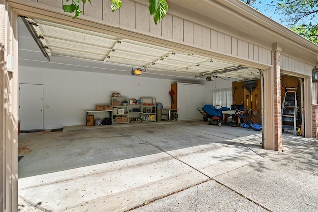 46890 Cider Mill Dr, Novi, MI 48374 - garage with a garage door opener and concrete driveway