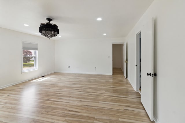 5242 Cedarhurst Dr, West Bloomfield, MI 48322 - empty room with recessed lighting, light wood finished floors, baseboards, and a chandelier