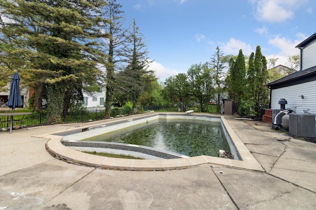 5242 Cedarhurst Dr, West Bloomfield, MI 48322 - view of pool with fence, central air condition unit, and a patio