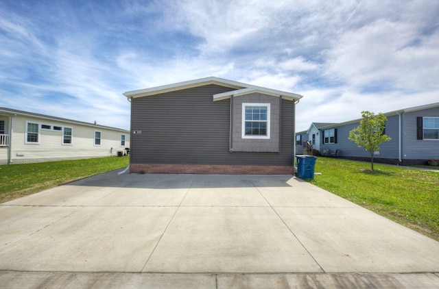 6418 Apple Way, Fenton, MI 48430 - view of side of property with brick siding and a yard