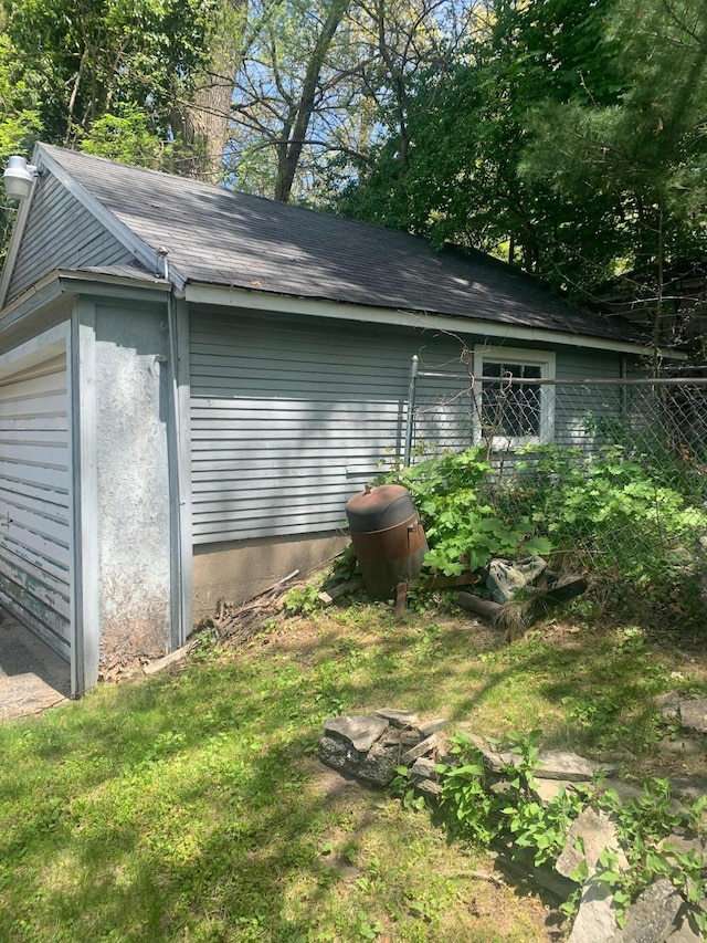 view of side of property featuring fence