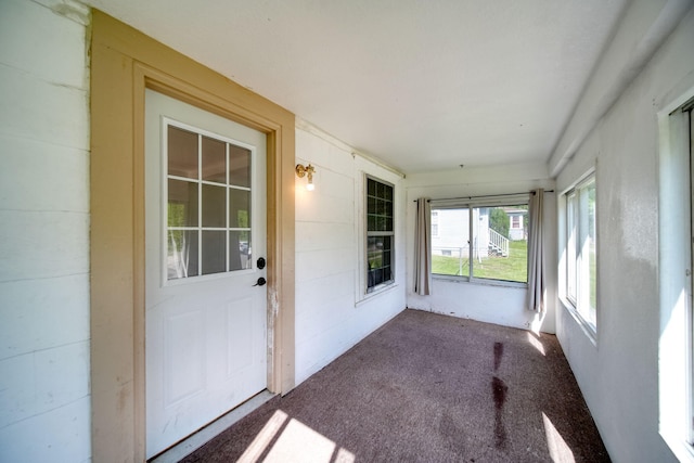 1702 Teneyck St, Jackson, MI 49203 - unfurnished sunroom with carpet flooring
