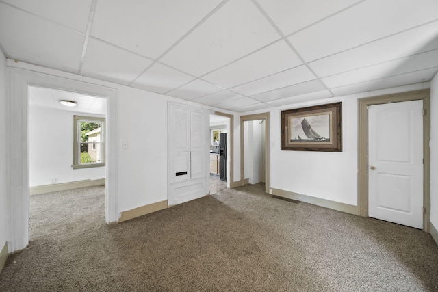 1702 Teneyck St, Jackson, MI 49203 - basement featuring a paneled ceiling, carpet, and baseboards