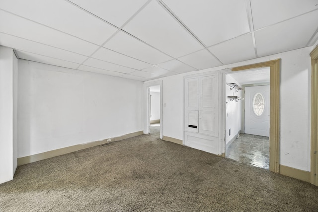 1702 Teneyck St, Jackson, MI 49203 - unfurnished bedroom with carpet, a paneled ceiling, and baseboards