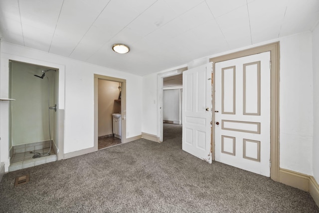 1702 Teneyck St, Jackson, MI 49203 - unfurnished bedroom featuring carpet flooring, ensuite bathroom, and baseboards