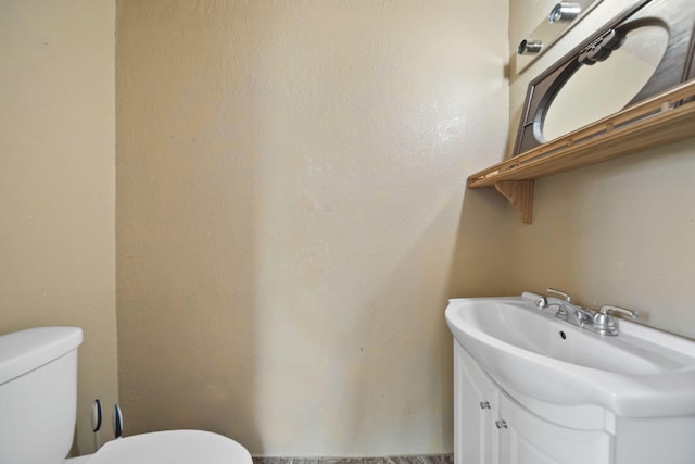 1702 Teneyck St, Jackson, MI 49203 - half bathroom featuring toilet and vanity