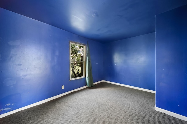 1702 Teneyck St, Jackson, MI 49203 - empty room featuring carpet floors and baseboards