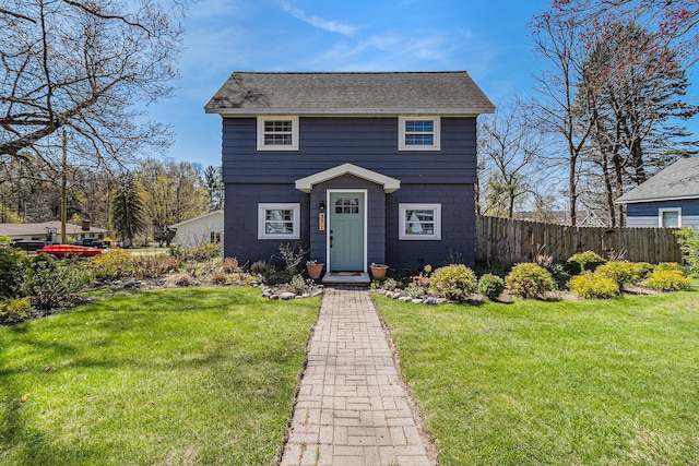 371 4th St, Pentwater, MI 49449 - view of front of home with a shingled roof