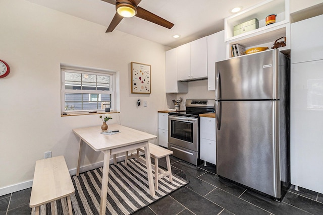 371 4th St, Pentwater, MI 49449 - kitchen with appliances with stainless steel finishes, white cabinetry, ceiling fan, open shelves, and recessed lighting
