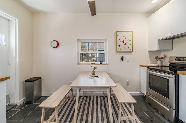 371 4th St, Pentwater, MI 49449 - dining area with baseboards and beam ceiling