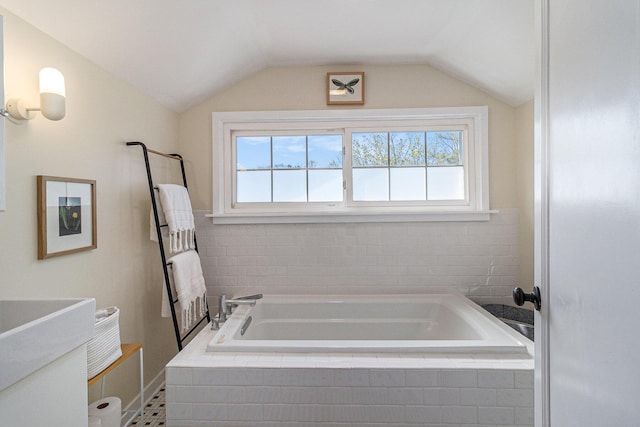 371 4th St, Pentwater, MI 49449 - bathroom with plenty of natural light, a garden tub, and lofted ceiling